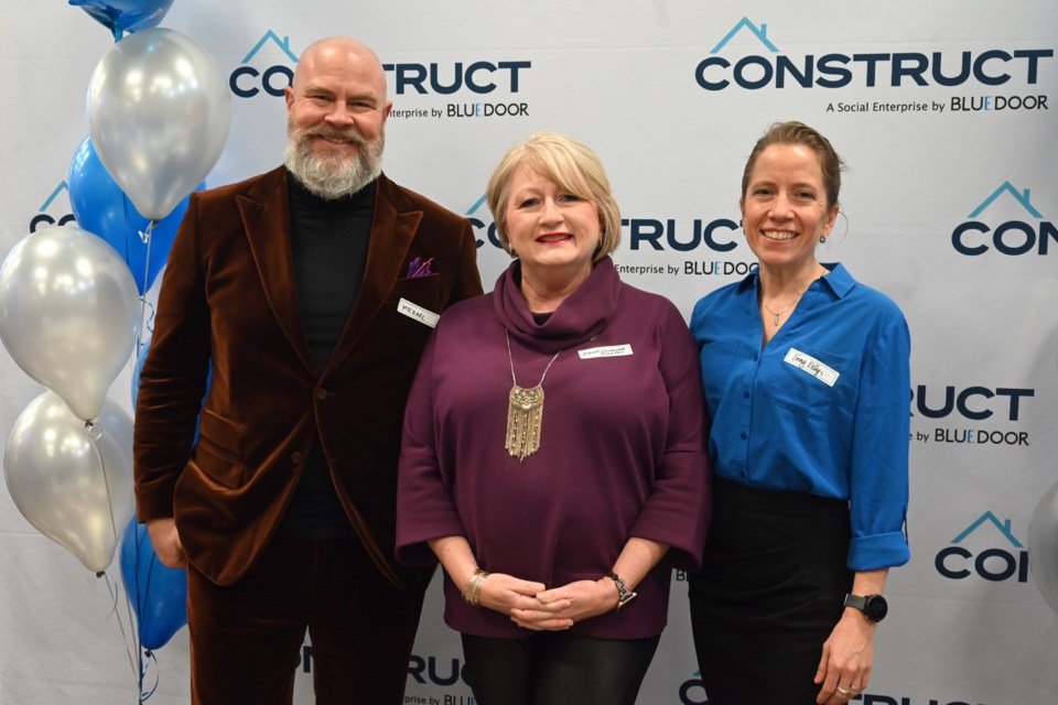 Blue Door CEO Michael Braithwaite, Newmarket-Aurora MPP Dawn Gallagher Murphy and Blue Door chief operating officer Emmy Kelly at the Construct second anniversary celebration.