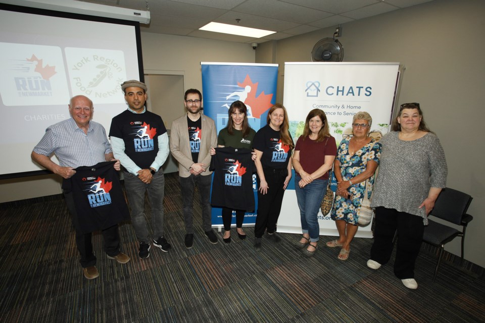 Newmarket-Aurora MP Tony Van Bynen, Arif Khan, Salman Ahmad, Kate Greavette, Kelly Broome, Andrea Sheppard, Moma Shaher, and Joanne Witt at the launch event for the 2nd annual Run for Newmarket at Newmarket Public Library May 27.  Greg King for NewmarketToday