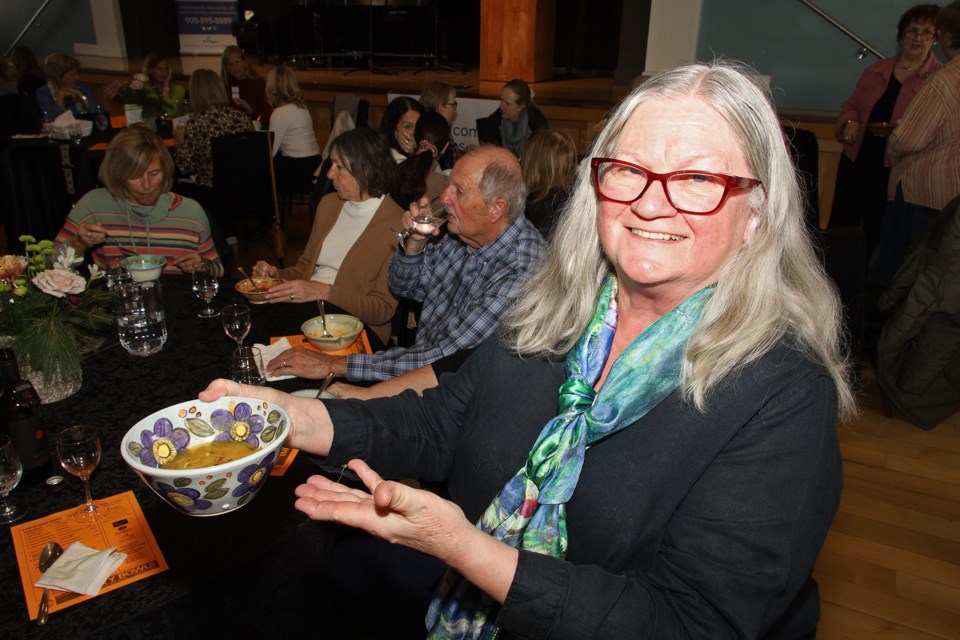 Teresa Dunlop is pleased with the pretty bowl she has chosen for her soup. File photo