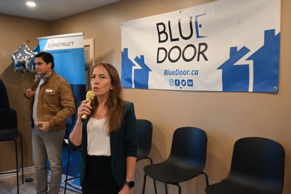 Blue Door chief operating officer Emily Kelly addresses an audience at an event celebrating the imminent completion of a new supportive housing facility in Newmarket Nov. 24. 