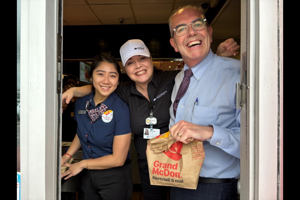 Hillary Ng Chang (left), Jennifer Ritter, president and CEO of Southlake Foundation, and Derek McNally, executive vice-president, clinical services, chief operating officer for Southlake Regional Health Care Centre, greet customers at the drive-thru window on McHappy Day at a Newmarket McDonald's.
