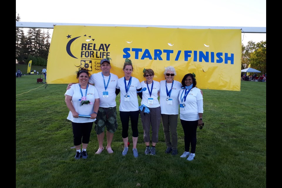 Lori Fitzgerald’s Sunset Beauties fundraising team run in the Relay for Life to honour their longtime friend and teammate Sarah, who passed away in 2017. 