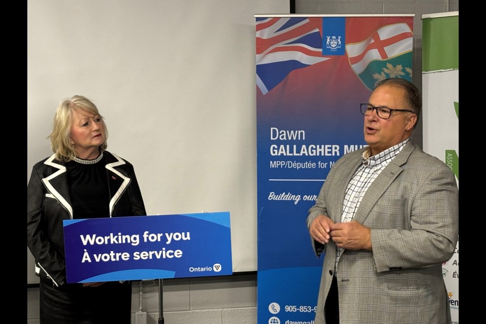 Newmarket-Aurora MPP Dawn Gallagher Murphy listens to Alain Beaudoin, CEO of Association des Francophones de la Région de York (AFRY), as he discusses the $200,000 grant and what it will be used for.