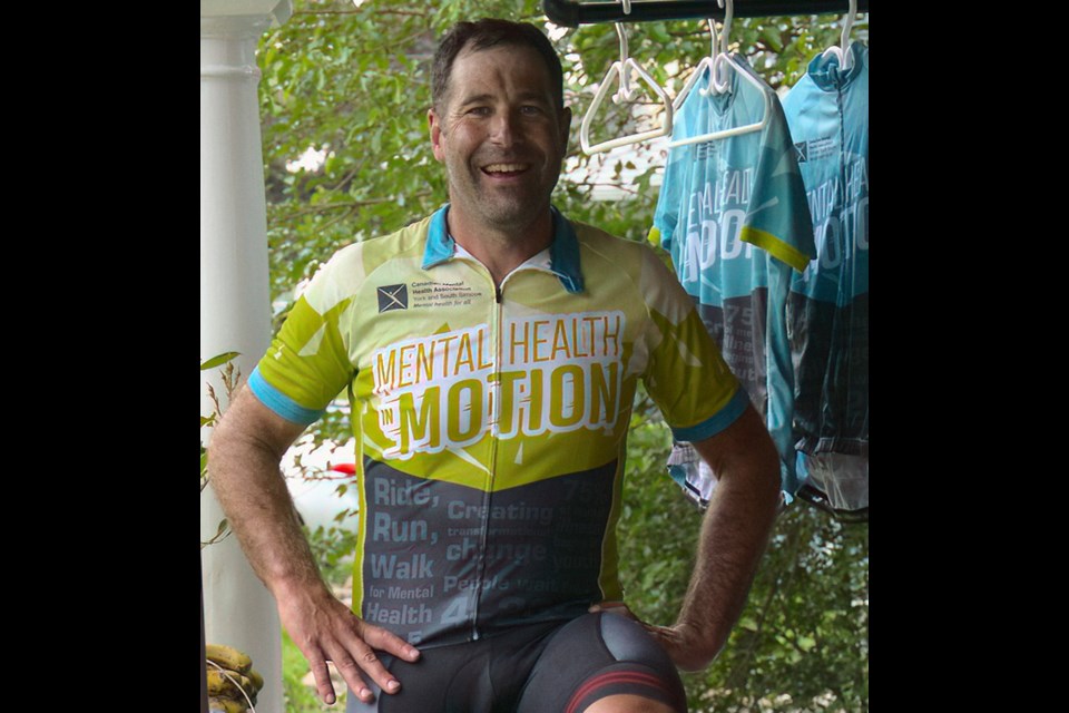 Mike Grimes is riding his bike on rollers for 24 hours on his Newmarket porch in support of CMHA's Mental Health in Motion.