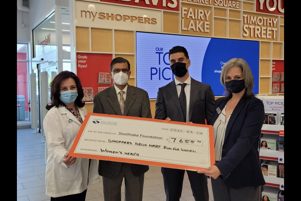 Shoppers Drug Mart owners Dragana Gasic, Mohammed Zahid, and Igor Gasic present a cheque to Julie Fiorini,  vice-president of marketing and community engagement at  Southlake Foundation.