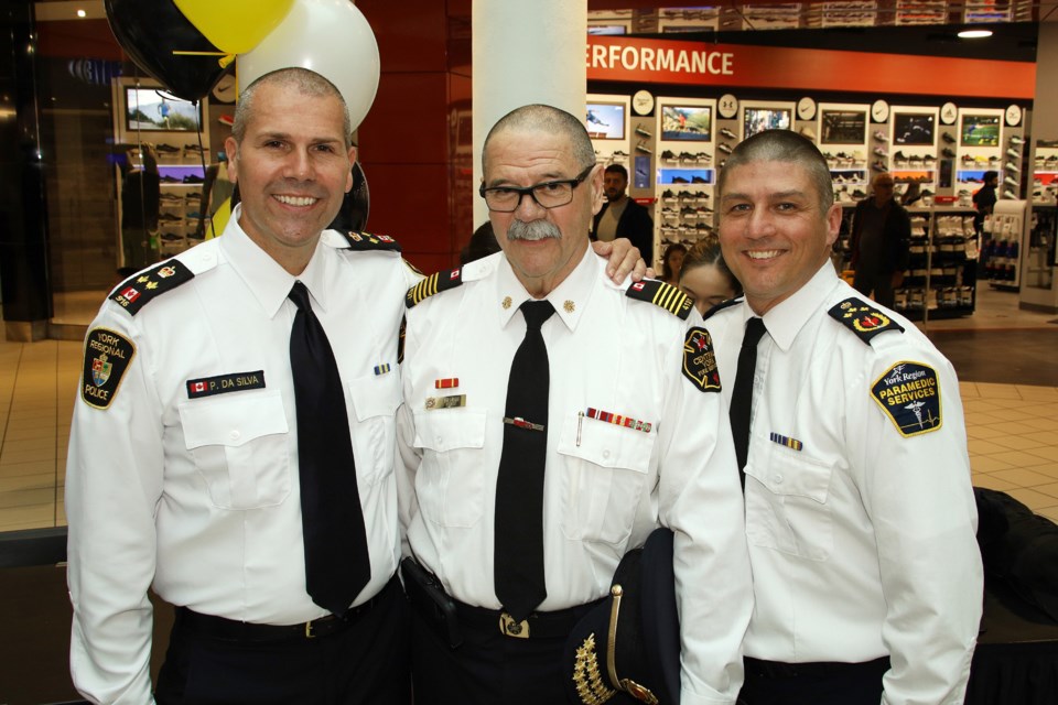 York Regional Police Deputy Chief Paulo Da Silva, York Central Fire Services Chief Ian Laing, and York Region Paramedic Services Chief Chris Spearen sport newly shaved heads at the Be a Hero campaign finale at Upper Canada Mall in Newmarket Saturday.  Greg King for NewmarketToday