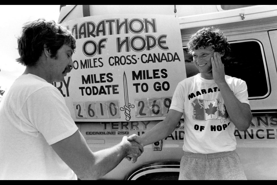Terry Fox greets a supporter during his Marathon of Hope.