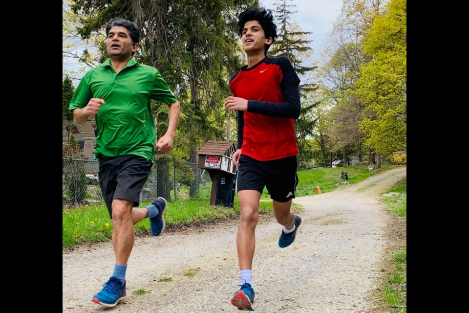 Vikash Jain, a Newmarket financial planner, is running 100 kilometres in May for the Alzheimer Society of York Region. His son, Ami, often joins him on his training runs.
