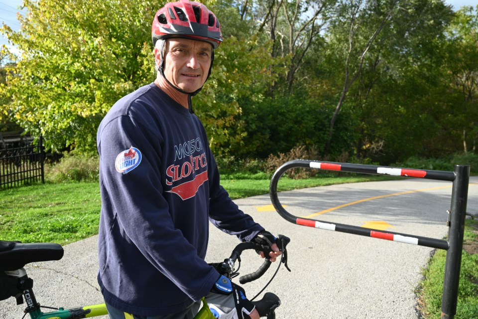 Cyclist Rob Wallace said he welcomes the town painting lines on Tom Taylor Trail.