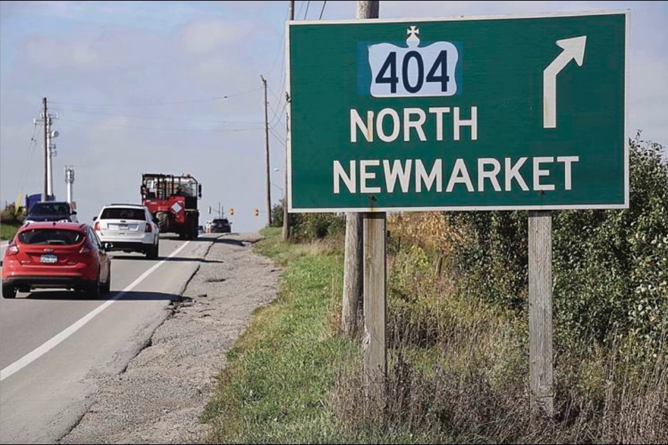 A sign for a Highway 404 exit to Newmarket.