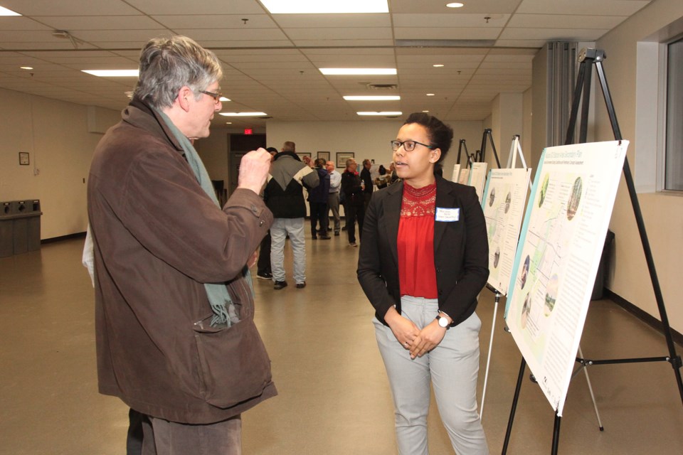 Resident Gordon Prentice poses a question to Dillon Consulting's Mariam Bello at the Town of Newmarket's Feb. 26 information session on the proposed Mulock GO Station Area Secondary Plan Study.  Greg King for Newmarket Today