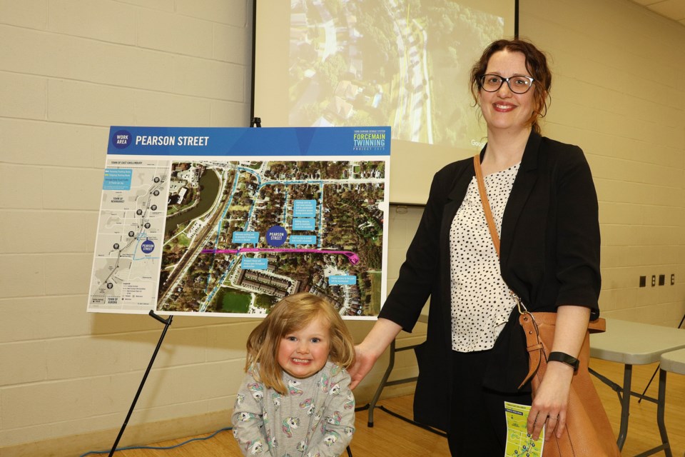 Michelle Bourdreau is seen here with her daughter, Hazel, the York Region forcemain twinning open house on May 15. One of the construction areas is directly in front of their home.  Greg King for NewmarketToday