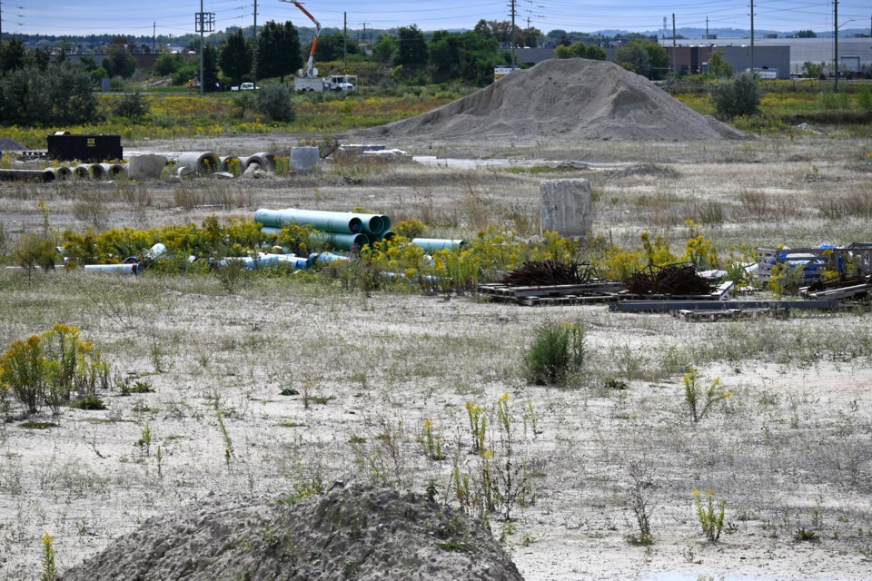 Construction is ongoing for a commercial complex at the corner of Davis Drive and Highway 404, but progress has been stalled by the pandemic according to a municipal report. 