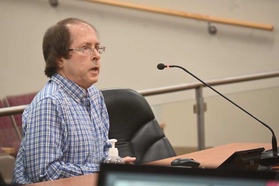 Peter Frost speaks to Newmarket council in opposition to a new 303-unit development on Leslie Street June 20. 