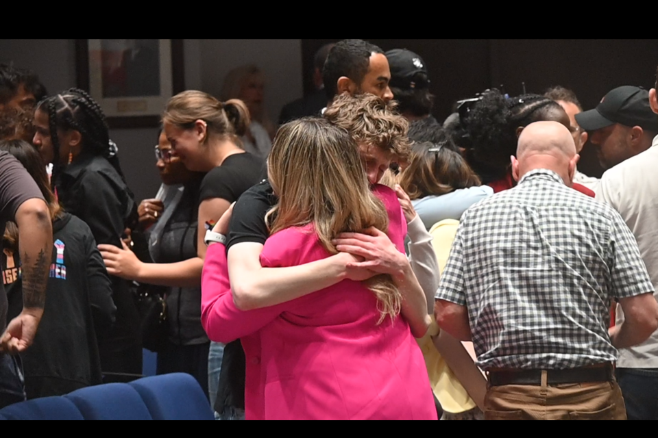 Supporters of 2SLGBTQIA+ embrace after the York Catholic District School Board votes against raising the Pride flag. 