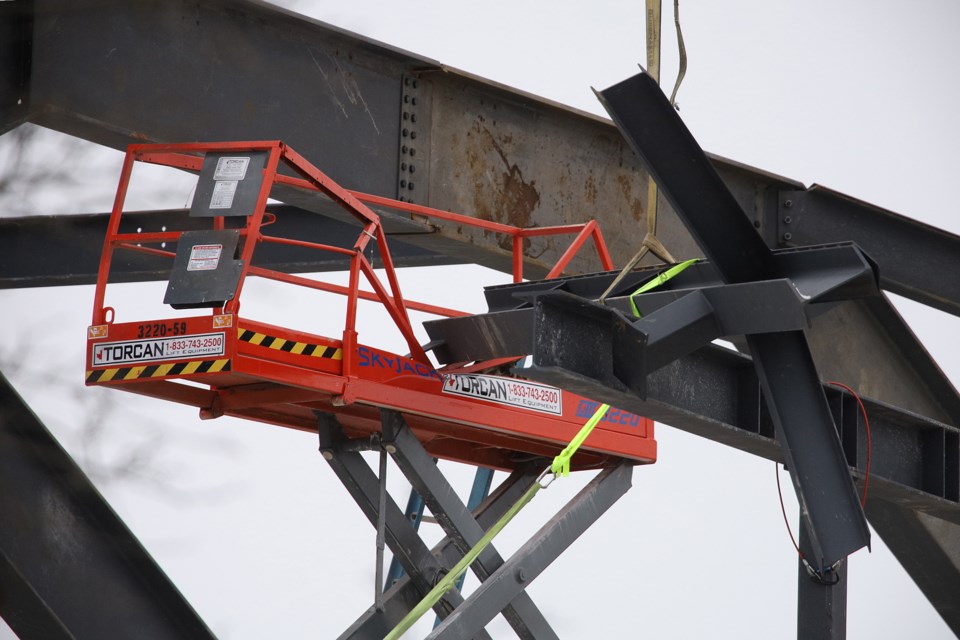 It appears that a beam being lifted by the crane dropped on a work platform.  Greg King for NewmarketToday
