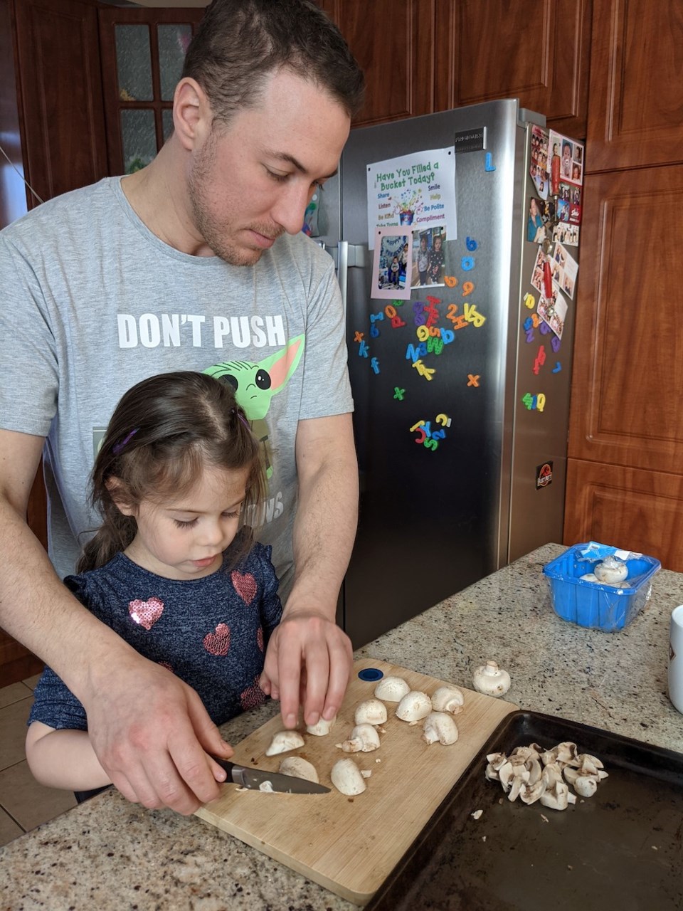 Chef Julian and Remi cutting mushrooms