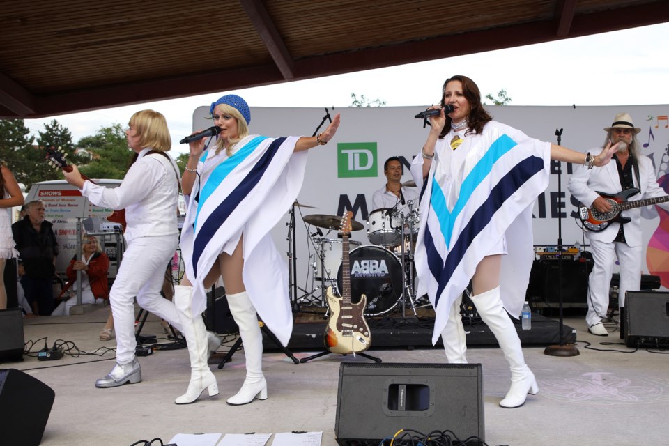'Frida' and 'Agnetha' of tribute band ABBA Revisited take to the stage for the largest turnout yet to the TD Newmarket Music Series concerts last night at Riverwalk Commons.  Greg King for NewmarketToday