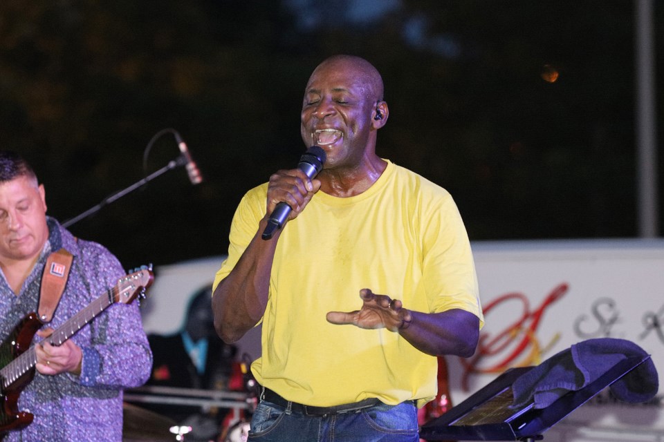 George St. Kitts brings the audience to its feet at the final Music in the Park concert series at Riverwalk Commons Thursday night.  Greg King for NewmarketToday
