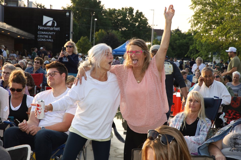 Chris Muzzir and Gail Smart dance to "The Boss" at the second of the outdoor concerts at Riverwalk Commons July 13.   Greg King for NewmarketToday