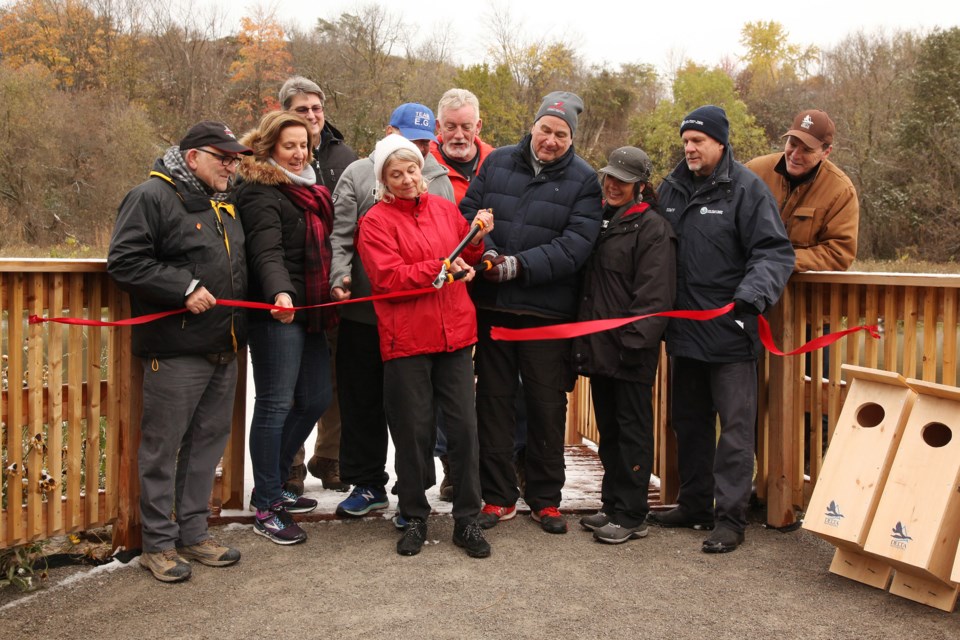 East Gwillimbury Mayor Virginia Hackson and Newmarket Councillor Dave Kerwin, LSRCA board members, cut the ribbon to the wetlands observation deck.  Photography by Greg King