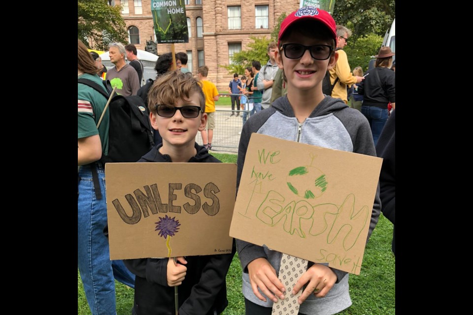 Newmarket's Adler and Harry joined the climate strike at Queen's Park Friday.  Supplied photo/Fran Bazos