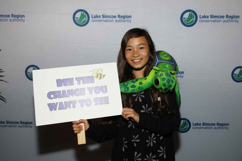 Nari Hwang takes Ernie Crossland Young Conservationist Award. She's shown here posing at the photo booth at the Nov. 7, 2019, awards ceremony.  Greg King for NewmarketToday