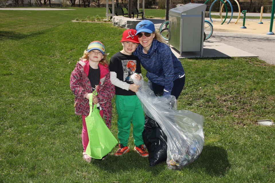 Katheryn Bain with Isla and Leyton at Rogers Park did their part, along with residents across Newmarket, on community cleanup day May 7.  Greg King for NewmarketToday