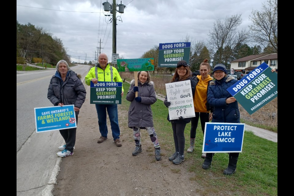 Local environmentalists gathered outside York-Simcoe MPP Caroline Mulroney's office to protest the Bradford Bypass and other government policy choices, including (from left) Joe Davis, Bill Foster, Raine Davis, Donna Strohm, Aaron Roberton and Alexandra Reznik. 