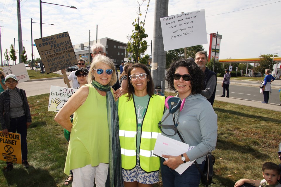 Aurora-Oak Ridges-Richmond Hill MP Leah Taylor-Roy (left) joins Pam Vega (middle) and Dena Farsad at the Sunday afternoon march in Newmarket.  Greg King for NewmarketToday