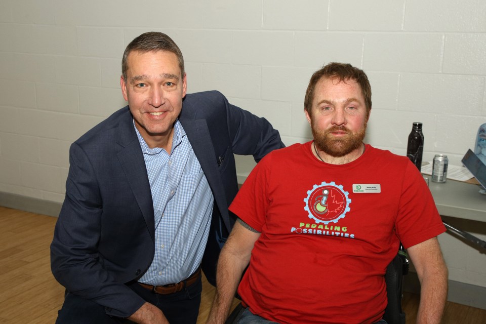 Newmarket Mayor John Taylor with Kevin Mills at the fundraising event April 28 for the Pedaling Possibilities' cross-country cycling tour.  Greg King for NewmarketToday
