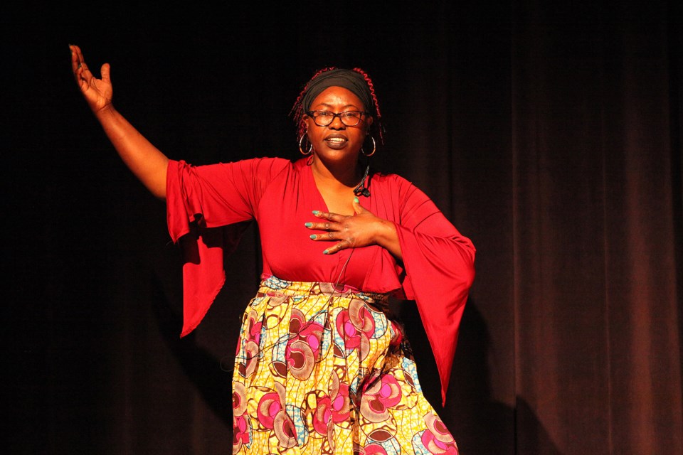 Desiree Smith recites 'Still I Rise' by Maya Angelou at the Black History Month event at the Old Town Hall yesterday.  Greg King for NewmarketToday