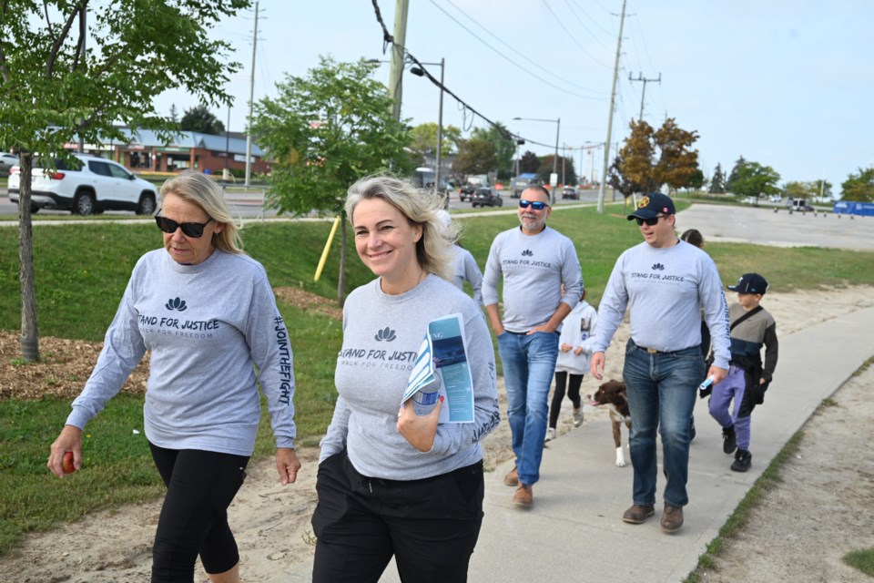 Newmarket Councillor Grace Simon (right), Councillor Christina Bisanz and Aurora Mayor Tom Mrakas participate in the Walk4Freedom in Newmarket Sept. 17. 
