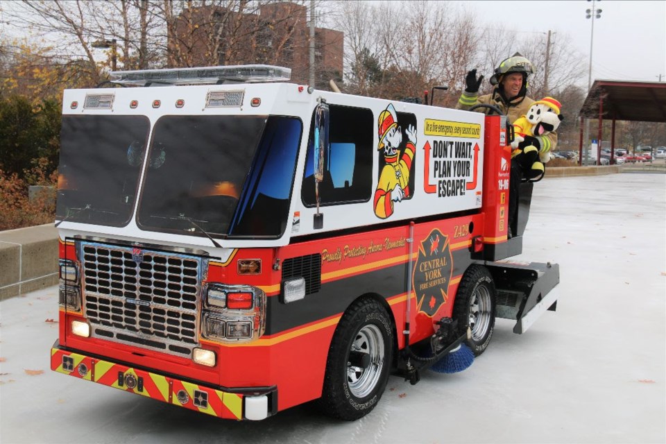 Town of Newmarket staff Zamboni driver uses Z429, part of the Central York Fire Services' fleet to prepare the ice at Riverwalk Commons, where the Zamboni will be stationed for the season.