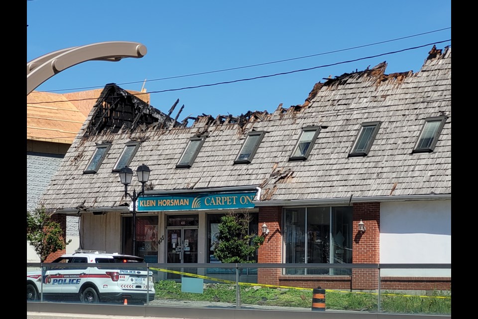 The Carpet One building on Davis Drive at Main Street in Nemarket sustained major damage in overnight fire. 