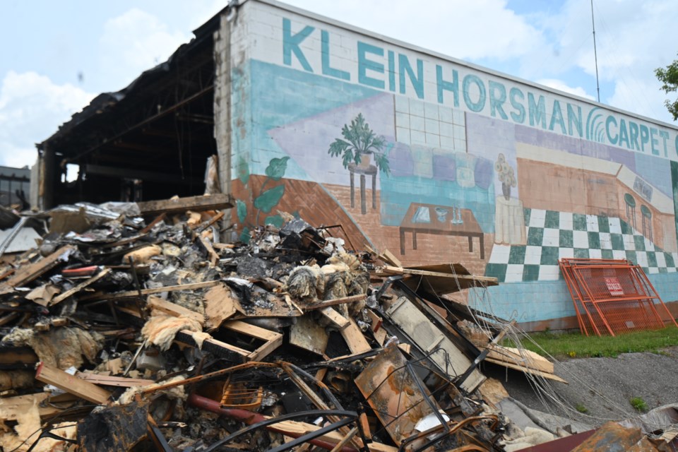 The Klein Horseman building nea Main Street and Davis Drive was ablaze July 22 and was partially demolished after the fire. 
