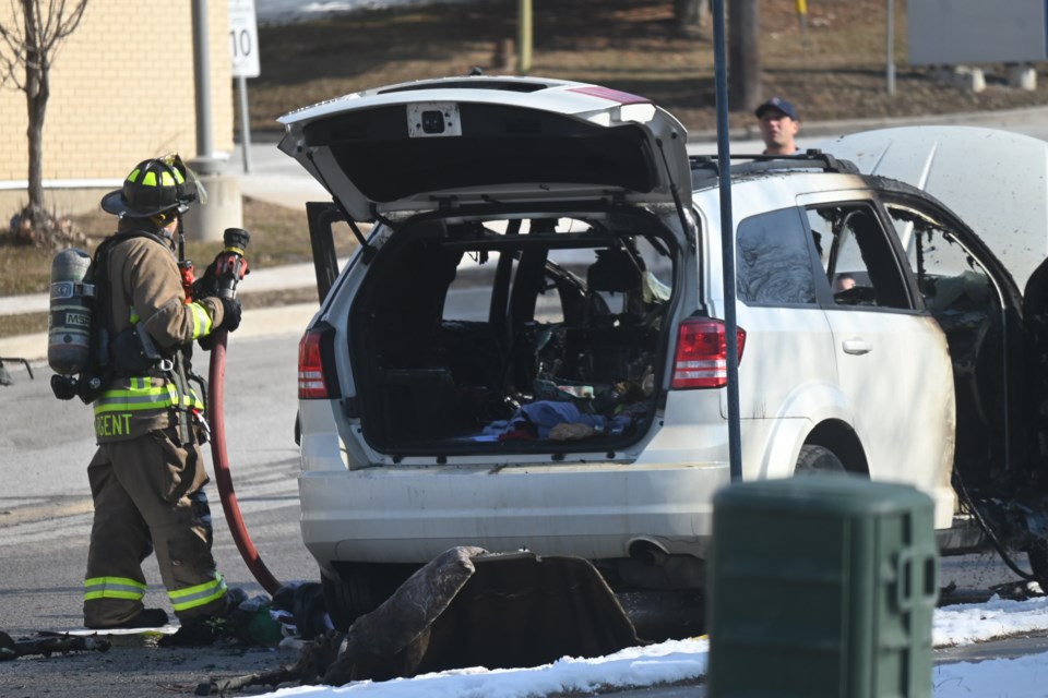 Firefighters address a burned out vehicle outside Southlake Regional Health Centre Feb. 21.