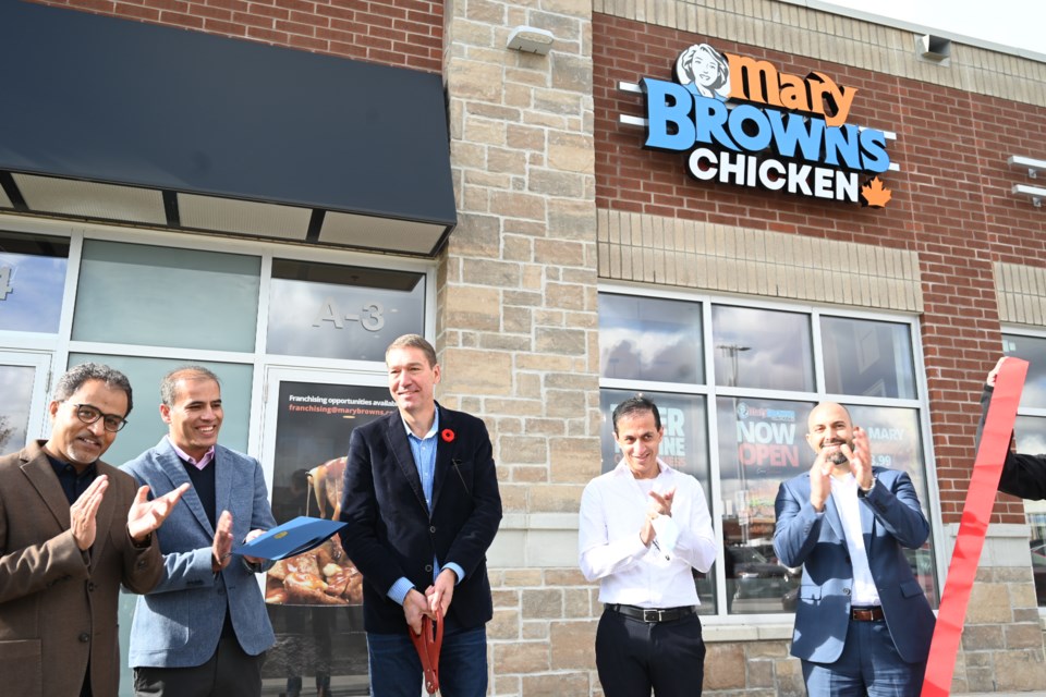 Newmarket celebrated the opening of a new Mary Brown's restaurant on Stonehaven Avenue Nov. 2. Left to right: Ikhram Khan, Noor Khan, Mayor John Taylor, Haseeb Khan, Mary Brown's president Hadi Chahin.  