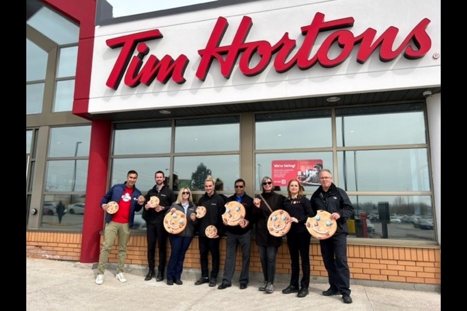 Local Tim Hortons owners with Inn From the Cold executive director Ann Watson. 
From left: Amit Seth, Chris Alexander, Cherylin Wall, Colton Thornton, Subash Suntharesan, Ann Watson, Carmen Wall, and Dan Wall.