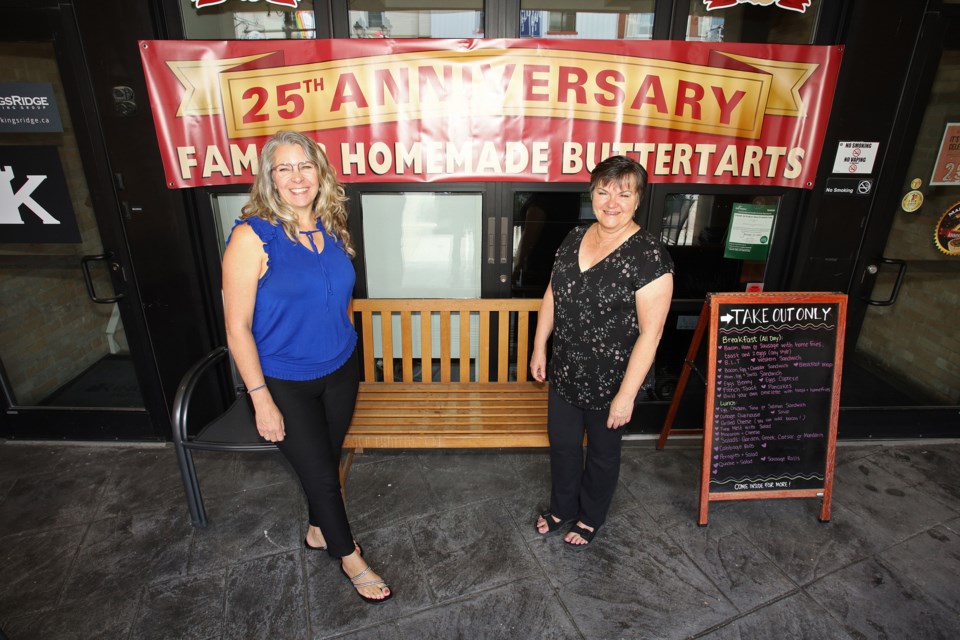 Maids' Cottage owners and sisters Pam Lewis and Debbie Hill celebrate the 25th anniversary of the Main Street business founded by their mother.  Greg King for NewmarketToday