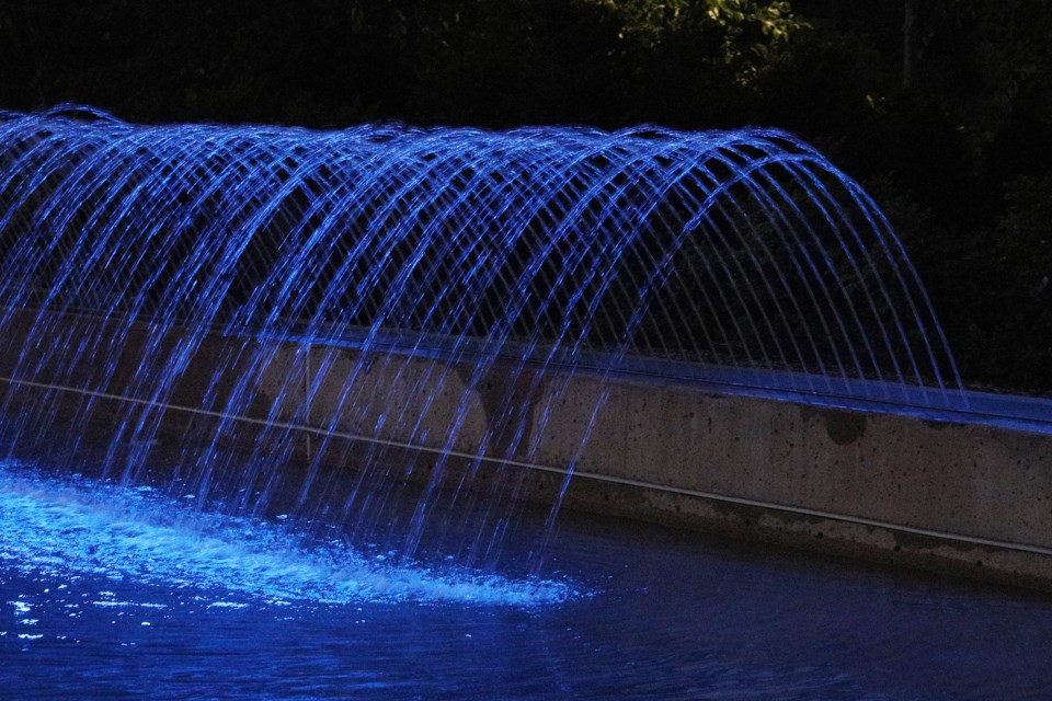 Tim Horton's water feature at Riverwalk Commons was blue last night for today's Dementia Friendly Day for World Alzheimer's Day.  Greg King for NewmarketToday