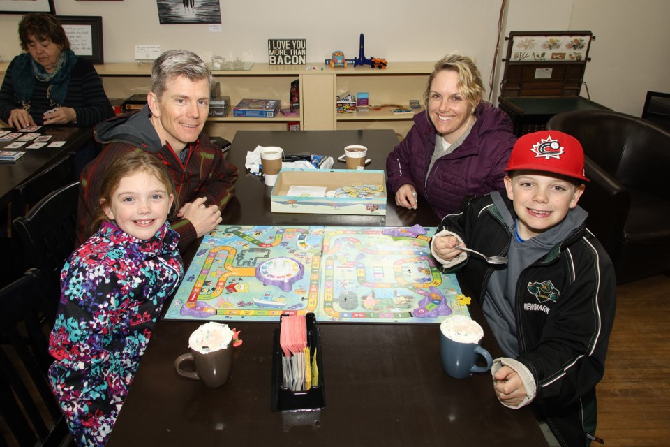 The Sage family (Maryn, John, Kristi, Cole) dropped in at A Hui Hou coffee shop on the weekend to play board games.  They will be making up a list of things to do around the house.  There will be a lot of tidy homes after this if others follow their example.  Greg King for NewmarketToday