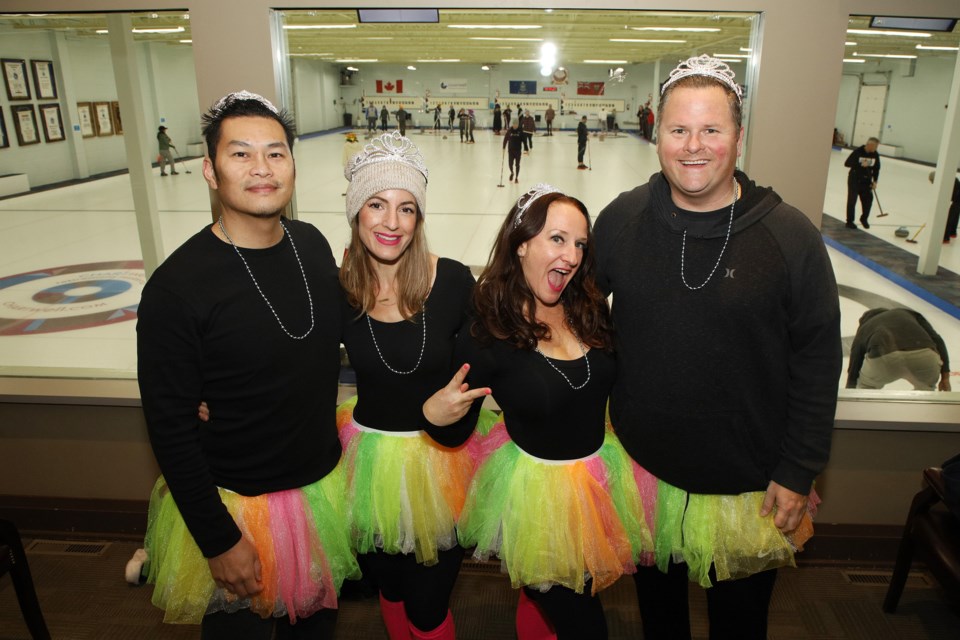Sweeping Beauties Dan Nguyen, Sasha Nguyen, Erin Cartwright, and Chris Cartwright are decked out in tiaras and tutus for Curl It for Sick Kids in memory of Noah Mayers, at the York Curling Club in Newmarket on Nov. 5. Greg King for NewmarketToday