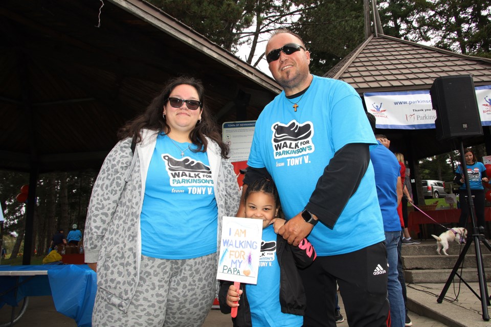 Tatyana Emmannuel and her daughter,Tomika, and Tony Viegas, are walking for Papa at the annual Parkinson's SuperWalk at Fairy Lake Park yesterday.  Greg King for NewmarketToday