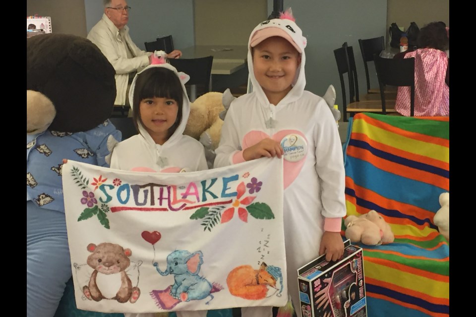 Sisters Louina and Mina Greenstein at Southlake's Pajamas and Pancakes event for pediatric oncology patients. File photo/NewmarketToday