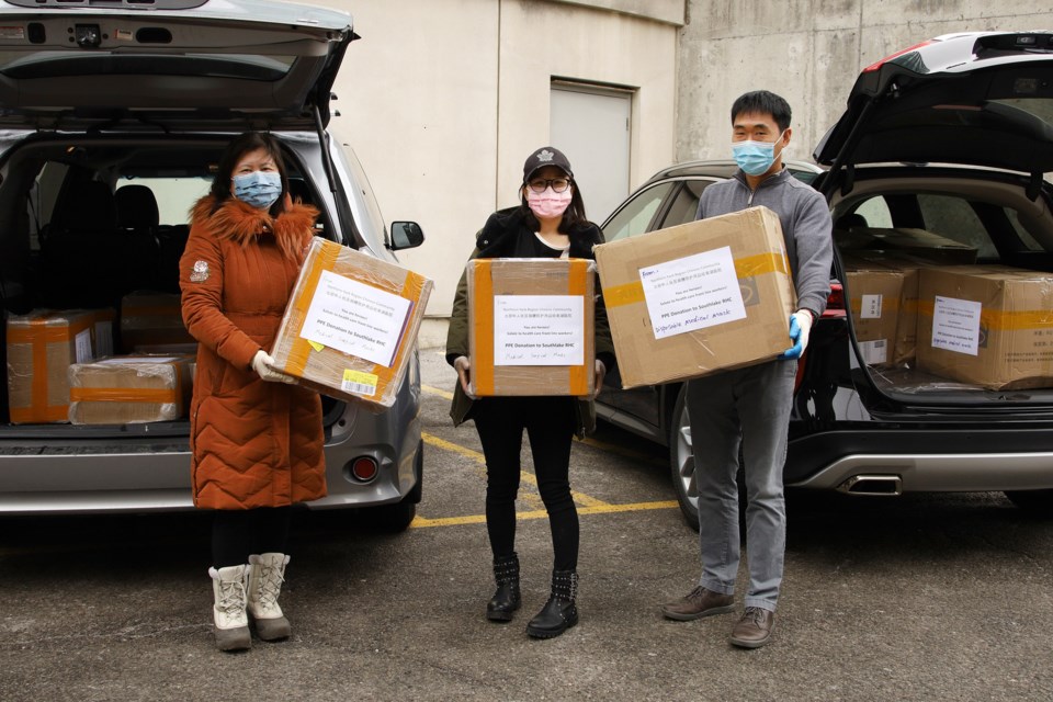 The Newmarket and area Chinese-Canadian community, represented her by Maureen Zhang (from left) Lisa Li, and Arthur Li, which donated more than 20,000 masks to Southlake Regional Health Centre.  Submitted photo