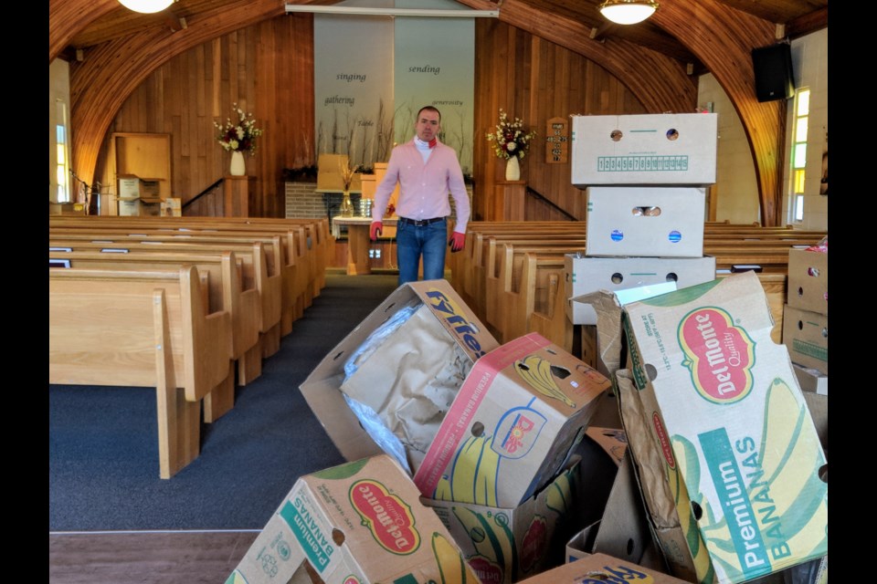 Newmarket Church of Christ pastor Nathan Pickard does some early work on May 4, 2020 to set up a food delivery program before volunteers arrive. Kim Champion/Newmarkettoday