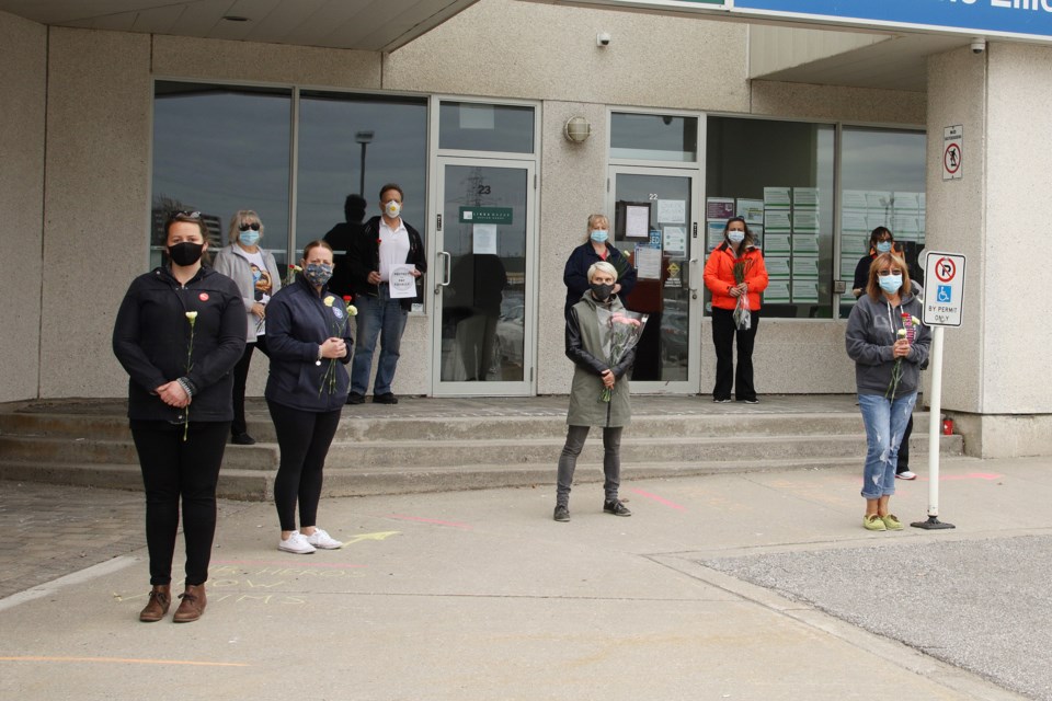 CUPE members gathered at Newmarket-Aurora MPP Christine Elliott's constituency office to pay tribute to those who caught COVID-19 at long term care facilities.  Greg King for NewmarketToday