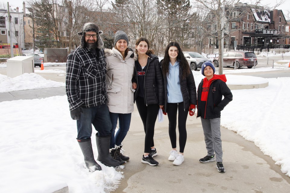 The Proctor family (Jer, Leslie, Paige, Brooke, and Jake) are on a scavenger hunt around downtown and Fairy Lake on Family Day, Feb. 15.  Greg King for NewmarketToday