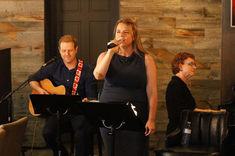 Come From Away creators and Newmarket residents David Hein and Irene Sankoff, with Anne Barnshaw on piano, perform songs from their shows at Cachet Supper Club June 23, raising $860 for residents at Eagle Terrace Long-Term Care home.   Greg King for NewmarketToday